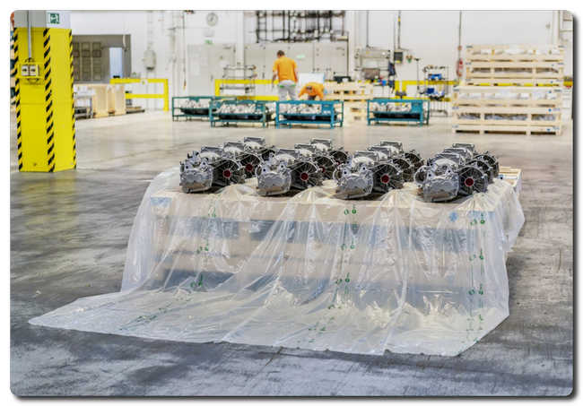 Car engines being wrapped in Eco-Corr Film® before ocean transport. The film will be composted after arrival. 