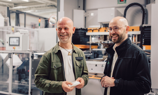 Fredrik Östbye, Head of Aliaxis Next and Linus Larsson Green, CEO of PulPac, standing in front of the PulPac Modula at the PulPac Tech Center in Gothenburg, Sweden. 